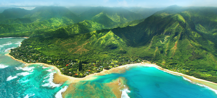 Hawaii aerial view, shoreline beach, lush green mountains