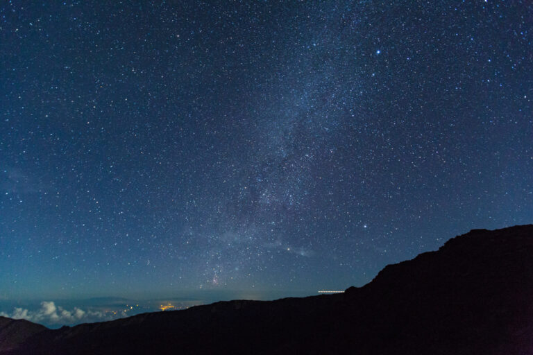 Star lit sky, summit of mountain