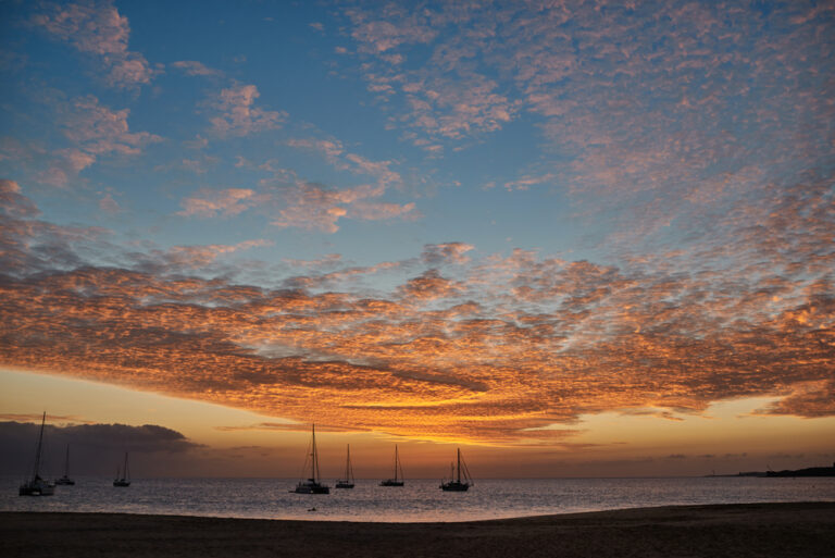 Sailboat silouettes at sunset